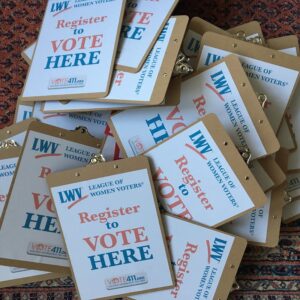 pile of register to vote clipboards