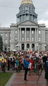 crowd gathered at base of colorado capitol