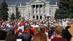 crowd gathered at base of colorado capitol