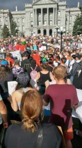 crowd gathered at base of colorado capitol