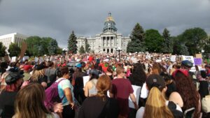 crowd gathered at base of colorado capitol