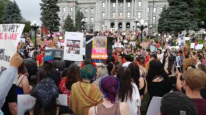 crowd gathered at base of colorado capitol