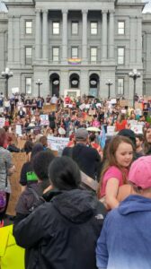crowd gathered at base of colorado capitol