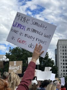 sign maybe someday women in america will have a many rights as guns do