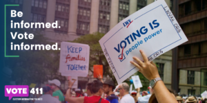 hand holding sign saying voting is people power